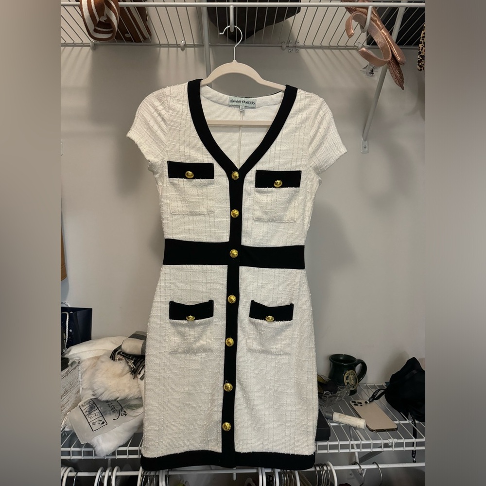 Elegant White and Black Dress with Gold Accents